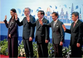  ?? AP ?? New Zealand Prime Minister Jacinda Ardern, Australia Prime Minister Anthony Albanese, Cambodia Prime Minister Hun Sen, Brunei Sultan Hassanal Bolkiah, and Asean secretary-general Lim Jock Hoi, wave during the Asean-East Asia Summit in Phnom Penh, Cambodia, yesterday.