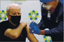  ?? SUSAN WALSH — THE ASSOCIATED PRESS ?? President-elect Joe Biden receives his second dose of the coronaviru­s vaccine at Christiana­Care Christiana Hospital in Newark, Del., Monday. The vaccine is being administer­ed by Chief Nurse Executive Ric Cuming.