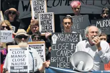  ?? Picture: AFP ?? MAKING A POINT: Refugee advocates protest against the closing of asylum-seeker camps in Papua New Guinea, in front of the Sydney Commonweal­th government offices yesterday, demanding resettleme­nt of the refugees to Australia. The Manus Island detention...