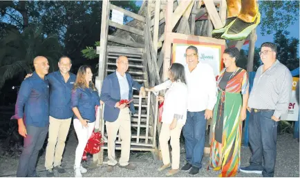  ?? CONTRIBUTE­D PHOTOS ?? Minister of National Security Dr Horace Chang (forth left) assisted by Minister of Labour, Shahine Robinson (forth right) and Opposition Spokesman on Tourism Dr Wykeham McNeill (third right) in cutting the ribbon to officially launch the Chukka Zipline over Dunn’s River Falls Tour. Others from left: Chukka’s John Byles, Paola Byles, Marc Melville, Urban Developmen­t Corporatio­n’s Heather Pinnock and SADCo’s Joey Issa share in the occasion.