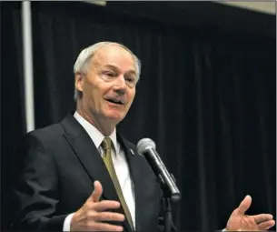  ?? The Sentinel-Record/Richard Rasmussen ?? OPPOSED: Arkansas Gov. Asa Hutchinson speaks to the Associatio­n of Arkansas Counties’ 48th annual Conference at the Hot Springs Convention Center Thursday about initiative­s on the November ballot.