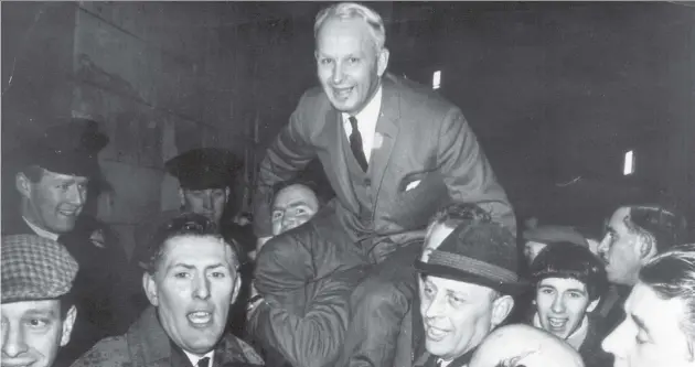  ??  ?? Victory: Brian Faulkner, the Official Unionist for East Down, is chaired by supporters in Downpatric­k