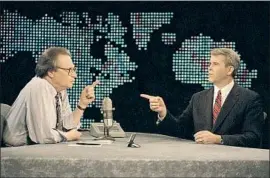  ?? Shayna Brennan Associated Press ?? LARRY KING, left, chats with guest Oliver North before the start of CNN’s “Larry King Live” in 1994. After a good interview, King said, “you know more.”
