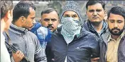  ?? ARVIND YADAV/HT PHOTO ?? Qureshi was apprehende­d on Saturday after a brief gunfight near the Paper Market in east Delhi’s Ghazipur.