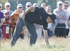  ?? Carolyn Kaster/Associated Press ?? Phil Mickelson checks his lie in the fescue on the 12th hole Thursday in the first first round of the U.S. Open.