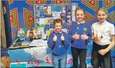  ??  ?? Pupils proudly show off a display from their school at the Edinburgh event.