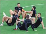  ?? SERGEI KARPUKHIN / REUTERS ?? Croatia players stretch during training in Moscow on Monday ahead of Wednesday’s World Cup semifinal against England.