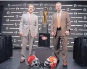  ?? DAVID J. PHILLIP/ASSOCIATED PRESS ?? Alabama coach Nick Saban, left, and Clemson coach Dabo Swinney know the drill, as they pose together with the national championsh­ip trophy on Sunday.