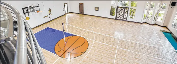  ?? Luxury Estates Internatio­nal ?? Las Vegas Raider defensive end Maxx Crosby paid $5.68 million for this estate in the guard-gated enclave of Mountain Trails in Summerlin North bordering Sun City Summerlin. It includes this indoor basketball court.