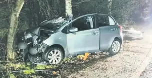  ??  ?? The Toyota Yaris after hitting a tree in Prestbury