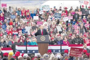  ?? JANIE OSBORNE | ASSOCIATED PRESS ?? PRESIDENT DONALD TRUMP speaks during a campaign rally at Bozeman Yellowston­e Internatio­nal Airport, in Belgrade, Mont., on Saturday. Trump was boosting Republican Matt Rosendale, who is seeking to knock off Sen. Jon Tester, D-Mont. The president later headed to a rally in Pensacola, Fla.