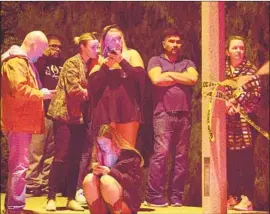  ?? Michael Owen Baker For The Times ?? PEOPLE mingle outside the Borderline Bar and Grill in Thousand Oaks, where a gunman said to be a 28-year-old former Marine killed 12 people.