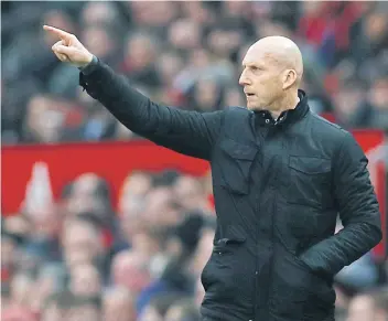  ??  ?? Reading manager Jaap Stam gives instructio­ns to his players during a match.