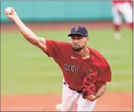  ?? Elise Amendola / Associated Press ?? Red Sox starting pitcher Nathan Eovaldi delivers to the Royals in the first inning on Thursday in Boston.