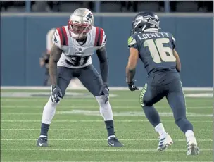  ?? AP FILE ?? New England Patriots defensive back Jonathan Jones, left, lines up against Seattle Seahawks wide receiver Tyler Lockett during last week’s game.