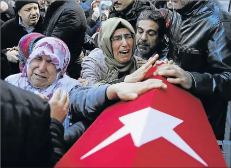  ?? Picture: REUTERS ?? GRIEVING FAMILY: Relatives of Fatih Cakmak, a security guard and a victim of the attack by a gunman at Reina nightclub, react during his funeral in Istanbul yesterday