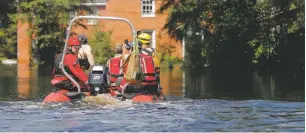  ?? GERALD HERBERT/ASSOCIATED PRESS ?? A swift rescue boat motors through floodwater­s Friday in the aftermath of Hurricane Florence in Nichols, S.C. Virtually the entire town is flooded and inaccessib­le except by boat, just two years after it was flooded by Hurricane Matthew.