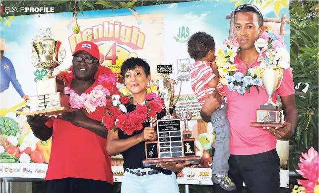  ?? PHOTO BY CHRISTOPHE­R SERJU ?? Jade Lee, Champion Female Farmer, is flanked by Neville Grant (left), National Champion Farmer, and Andrew Simpson, Young Champion Farmer, after they all received their garlands at the recent Denbigh Agricultur­al, Industrial and Food Show.