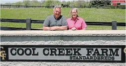  ?? PHOTO BY MEAGAN MACKIMMIE ?? Harry and Diane Rutherford pose outside Cool Creek Farm near Brantford.