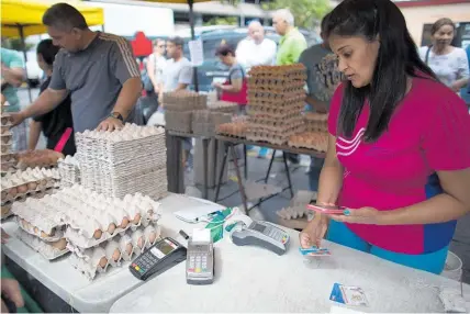  ?? Photo / AP ?? With the currency losing its value so quickly, Venezuelan­s have started using eggs in some transactio­ns.