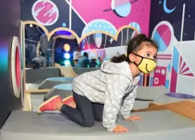  ?? Chris Schneider, provided by the Denver Museum of Nature & ?? A child plays in the renovated Space Odyssey exhibit at Denver Museum of Nature & Science on Oct. 29, 2020. Visits to institutio­ns such as DMNS are free on select days, thanks for SCFD funding.