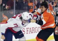  ?? DERIK HAMILTON — THE ASSOCIATED PRESS ?? The Capitals’ T.J. Oshie, left, and the Flyers’ Travis Konecny fight during the third period of an NHL game in Philadelph­ia. A tight race among contenders in the Metropolit­an Division should have the top five teams battle-tested and playoff-ready.