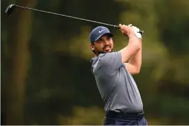  ?? The Associated Press ?? ■ Jason Day of, Australia, hits off the 11th tee during the first round of the Wells Fargo Championsh­ip Thursday at TPC Potomac at Avenel Farm golf club in Potomac, Md.