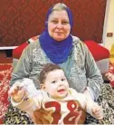  ?? COURTESY PHOTO ?? Hend Selim’s mother, Fatma Sayed, holds Selim’s son in January.