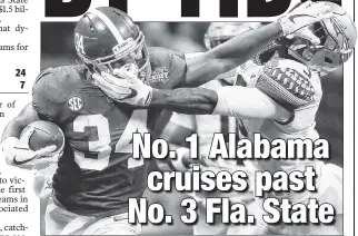  ??  ?? TAKE THAT! Alabama’s Damien Harris applies the stiff-arm to Florida State’s Derwin James in the Crimson Tide’s 24-7 win Saturday. AP