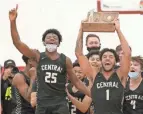  ?? BARBARA J. PERENIC/COLUMBUS DISPATCH ?? Tasos Cook (1) and Buba Bangura (25) lead the celebratio­n after Westervill­e Central’s regional final win over Gahanna on March 13.