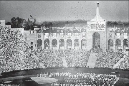  ?? Associated Press ?? THE 1932 OLYMPICS take place at the L.A. Coliseum despite many obstacles and thanks largely to the efforts of Billy Garland.