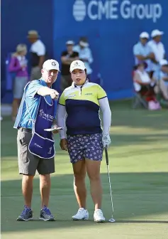  ?? — AFP photo ?? Shanshan Feng of China prepares to putt on the 18th hole during the first round of the CME Group Tour Championsh­ip at Tiburon Golf Club on November 17, 2016 in Naples, Florida.