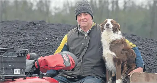  ??  ?? ALTERNATIV­E: Farm manager at Penicuik Estate John Davidson, here with dog Peg, uses thermal hydrolysis cakes on the land as fertiliser