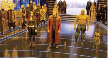  ??  ?? (left) The dysfunctio­nal Guardians of the Universe are all set to save the universe for a second time. Reprising their roles … (right, above) Pratt (left) with director Gunn; and Saldana having to do more stunts in the sequel.