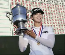  ?? SETH WENIG/THE ASSOCIATED PRESS ?? Winning the U.S. Women’s Open and its $900,000 top prize gave Sung Hyun Park plenty to smile about on Sunday at Trump National Golf Club.