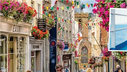  ?? ?? SHORT HAUL: St Peter Port’s picturesqu­e high street in Guernsey. Right: Pets are welcome on many crossings