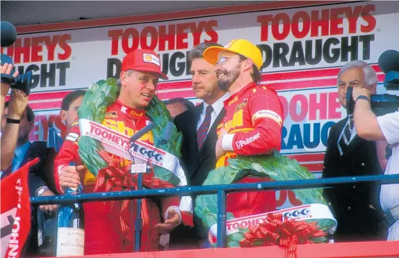  ?? Photos / AN1 Media ?? Dick Johnson, left, and John Bowe after winning the 1989 Bathurst 1000.