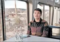  ??  ?? Di Li, 29, has been traveling after quitting his job as an electrical engineer in California. When the weather in Chicago turned cold, he hopped aboard the Southwest Chief and headed home to
Los Angeles to repack his bags.