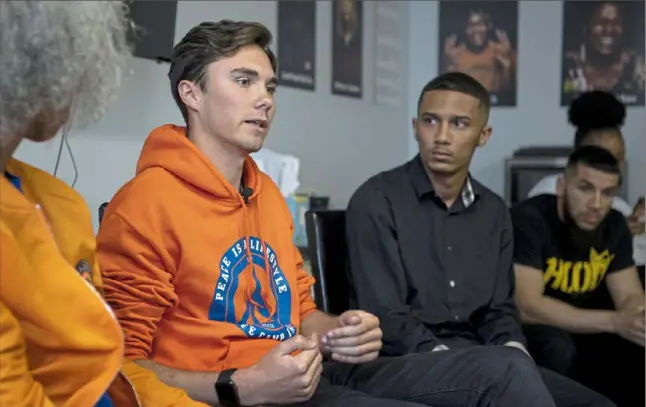  ?? Alexandra Wimley/Post-Gazette photos ?? David Hogg, left, co-founder of March for Our Lives and survivor of the shooting at Marjory Stoneman Douglas High School in Florida, speaks Wednesday during a youth activism meeting at 1Hood Media in Oakland. To his right is Kahlil Darden, of Penn Hills, a youth organizer.