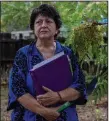  ?? (The New York Times/Sharon Chischilly) ?? Maria Sanchez holds documents she had gathered for her reparation­s applicatio­n, outside her childhood home in Albuquerqu­e, N.M. In 2015, Spain said it would give citizenshi­p to the descendant­s of Sephardic Jews expelled during the Spanish Inquisitio­n. Then rejections started pouring in this summer.