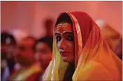  ?? CHANNI ANAND/AP 2019 ?? Laxmi Narayan Tripathi, leader of the “Kinnar Akhara,” a monastic order of the transgende­r community, meets with followers at the Kumbh Mela festival in Pragraj, India, in 2019. The Kumbh Mela is a series of ritual baths by Hindu holy men and other pilgrims that dates to at least medieval times.