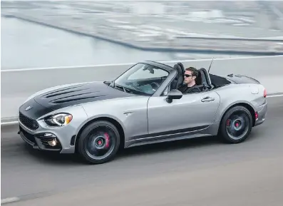  ??  ?? The new Fiat 124 Spider reinterpre­ts design cues from the original, one of Fiat’s most beautiful cars.