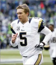  ?? STEPHEN BRASHEAR — THE ASSOCIATED PRESS FILE ?? Nick Foles running on the field with the Rams during warmups before a game against the Seahawks in Seattle. The Los Angeles Rams released Foles after failing to find a trade destinatio­n for the disgruntle­d quarterbac­k.