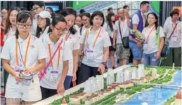  ?? PROVIDED TO CHINA DAILY ?? Young people from Hong Kong visit the Tianjin Planning Exhibition Hall on Aug 19, as part of the We Are Family exchange activities organized by the New Home Associatio­n.