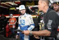  ?? NICK WASS - THE ASSOCIATED PRESS ?? Ryan Blaney signs autogrpahs before practice Dover Internatio­nal Speedway in Dover, Del. Oct. 6 at