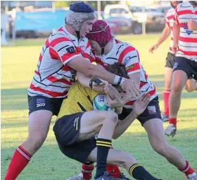  ?? PHOTO: CONTRIBUTE­D ?? WRAPPED UP: Toowoomba Rangers defenders Fraser Donaldson and Hugh wright wrap up a Goondiwind­i opponent in the Risdon Cup semi-finals.