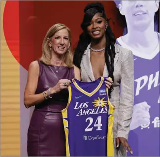  ?? ADAM HUNGER — THE ASSOCIATED PRESS ?? Rickea Jackson, right, poses with WNBA commission­er Cathy Engelbert after being drafted by the Sparks.