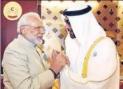  ?? PTI ?? Prime Minister Narendra Modi being welcomed by Crown Prince of Abu Dhabi, Deputy Supreme Commander of U.A.E. Armed Forces, General Sheikh Mohammed Bin Zayed Al Nahyan, on his arrival, at Abu Dhabi on Saturday.