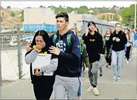  ?? [MARCIO JOSE SANCHEZ/ THE ASSOCIATED PRESS] ?? Students are escorted out of Saugus High School after reports of a shooting Thursday in Santa Clarita, Calif.