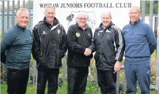  ??  ?? New team Wishaw chairman Bill Kilgour welcomes John Brogan as Wishaw manager, alongside his backroom team of Scott Gemmell (left) and Colin Mitchell (Pic by David Bell)